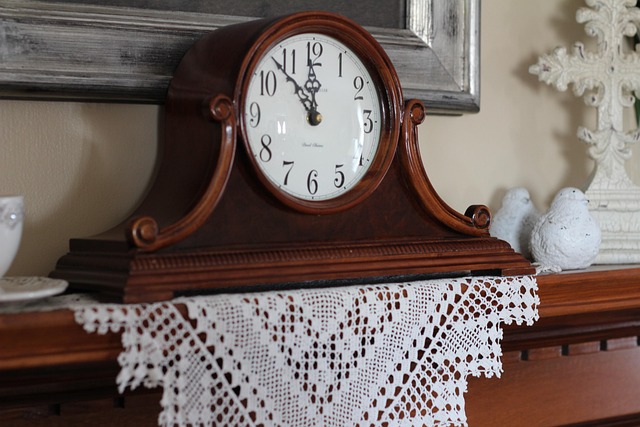Vintage mantel clock with carved wood detail and lace runner